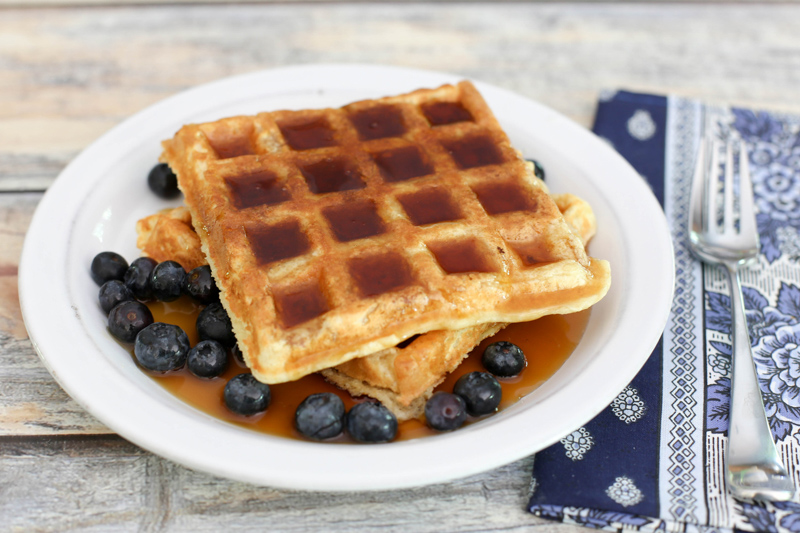 Basic buttermilk waffles with berries and syrup.