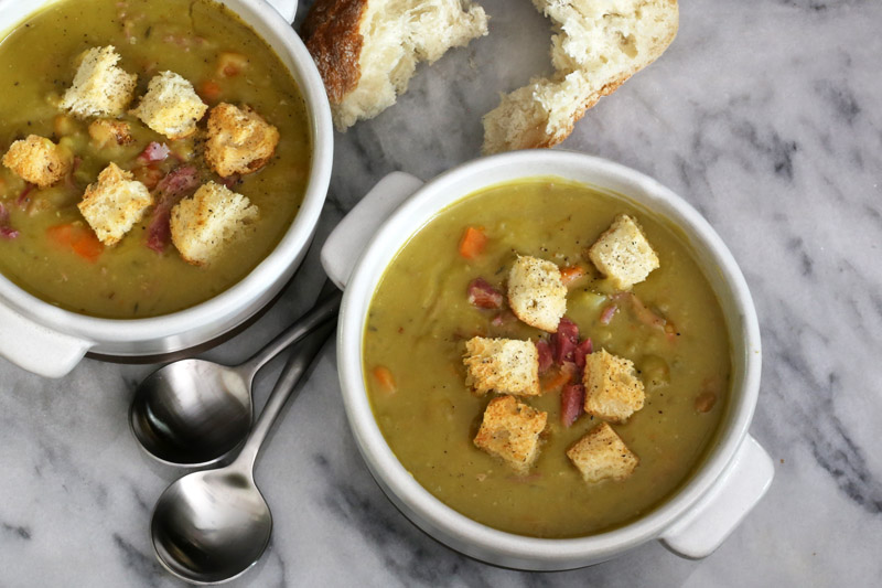 Slow cooker pea soup with croutons.