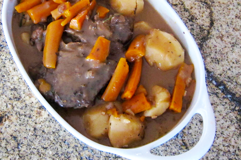 Slow cooker pot roast with vegetables and gravy.