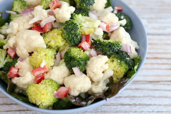 Cauliflower and broccoli salad in a bowl.