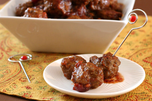 Cranberry appetizer meatballs are cooked in the slow cooker.