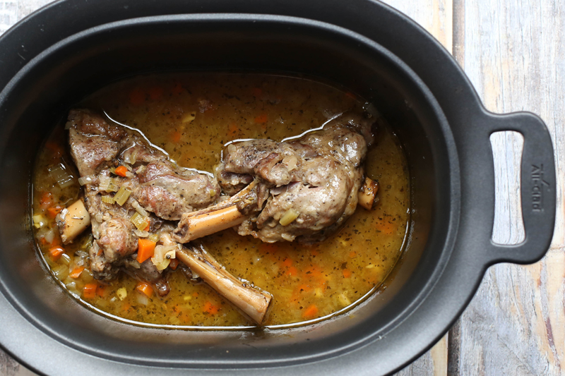 Slow cooker lamb shanks with vegetables and rosemary.
