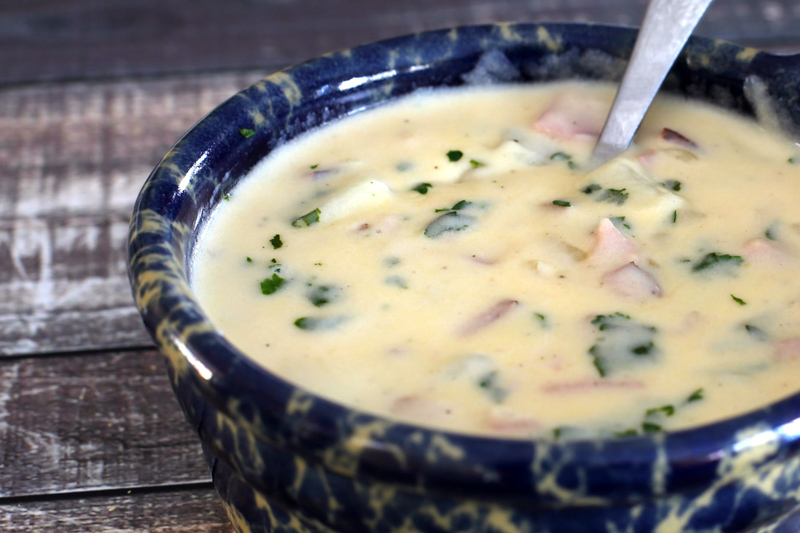 Potato soup with ham and parsley.