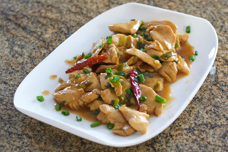 Asian Hunan chicken with chili peppers and soy sauce.