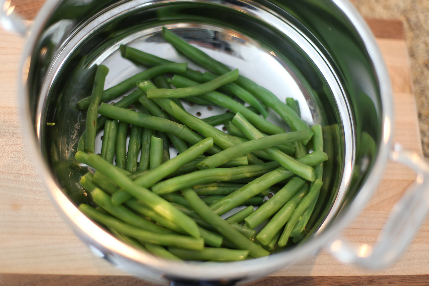 Green beans in a steamer.
