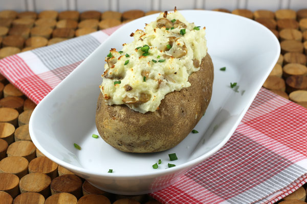 Baked stuffed potatoes with mushrooms.
