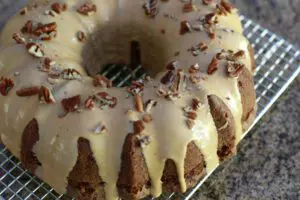 glazed apple bundt cake on a cooling rack