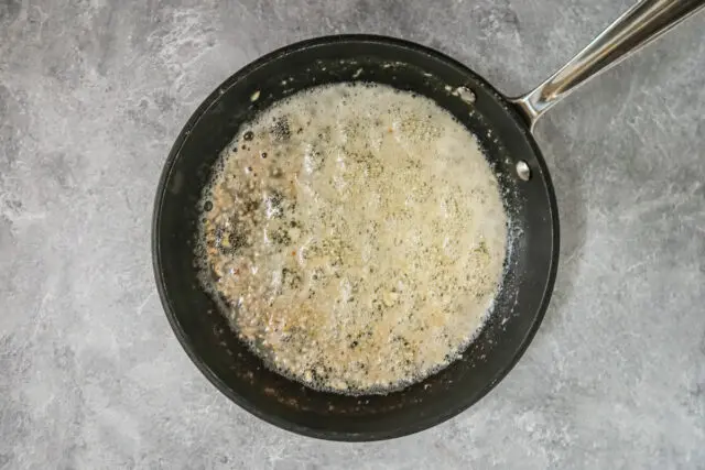 Making the garlic and butter sauce for air fryer garlic Parmesan chicken wings.