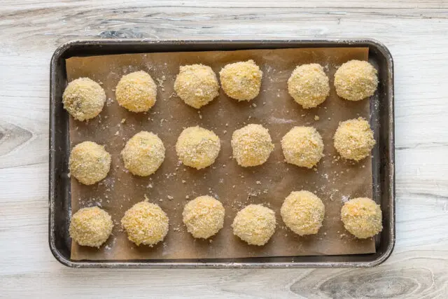 Set up a breading station with 1/2 cup of flour in one bowl, 2 beaten eggs in a second bowl, and 1 1/2 cups of panko crumbs.