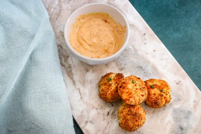 Crisp on the outside and soft inside, air fryer mashed potato croquettes with some dip on the side.