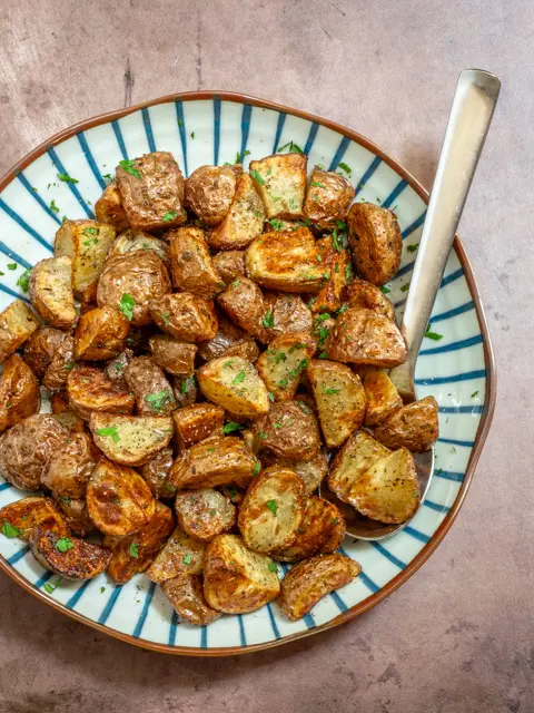 air fryer potatoes in a serving dish