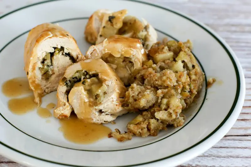 stuffed chicken breasts with apple stuffing and more on the side.