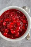 Homemade cranberry sauce in a small bowl.