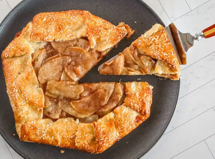 an apple galette with a slice cut out of it