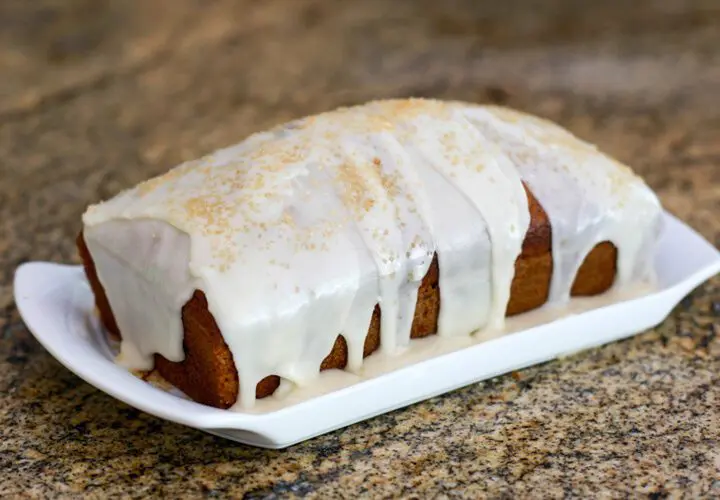 applesauce cake glazed and garnished with demerara sugar.