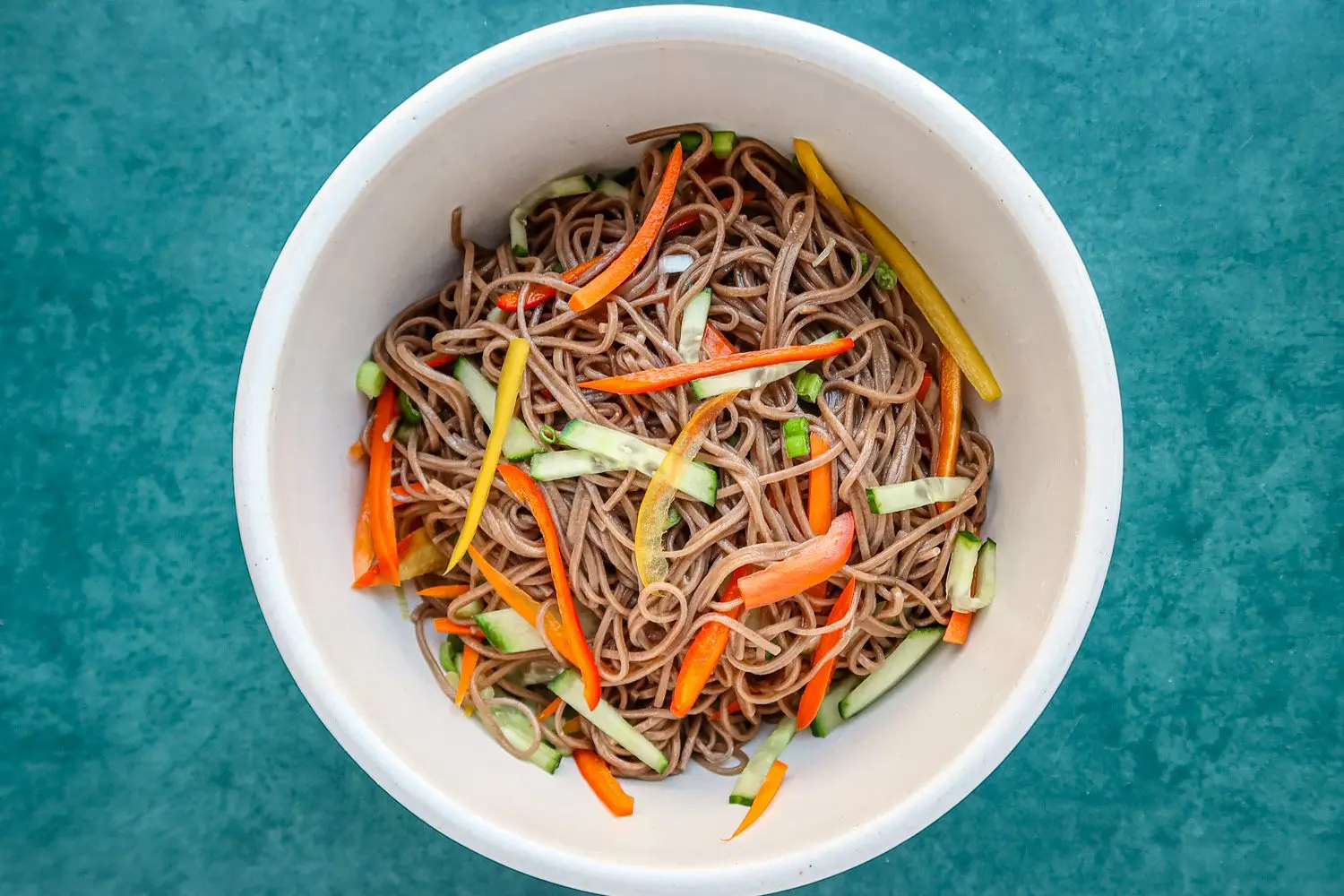 Asian flavored cold noodle salad in a bowl with soba noodles