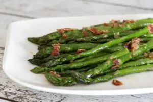 asparagus with bacon on a small platter