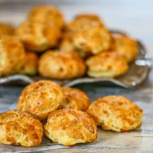 a plate of bacon cheese puffs