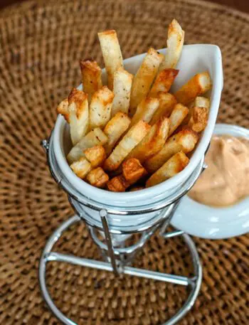 baked fries in a porcelain french fry cup