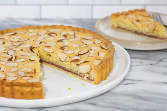 bakewell tart with a slice in the background