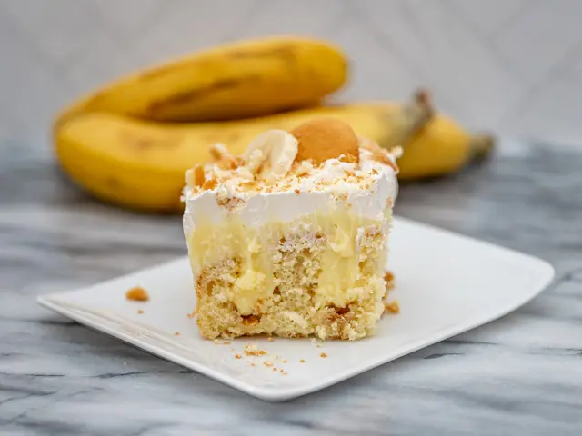 slice of banana pudding poke cake