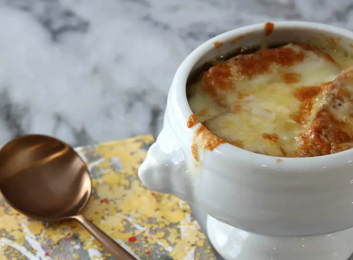 basic french onion soup in a bowl with melted cheese on top