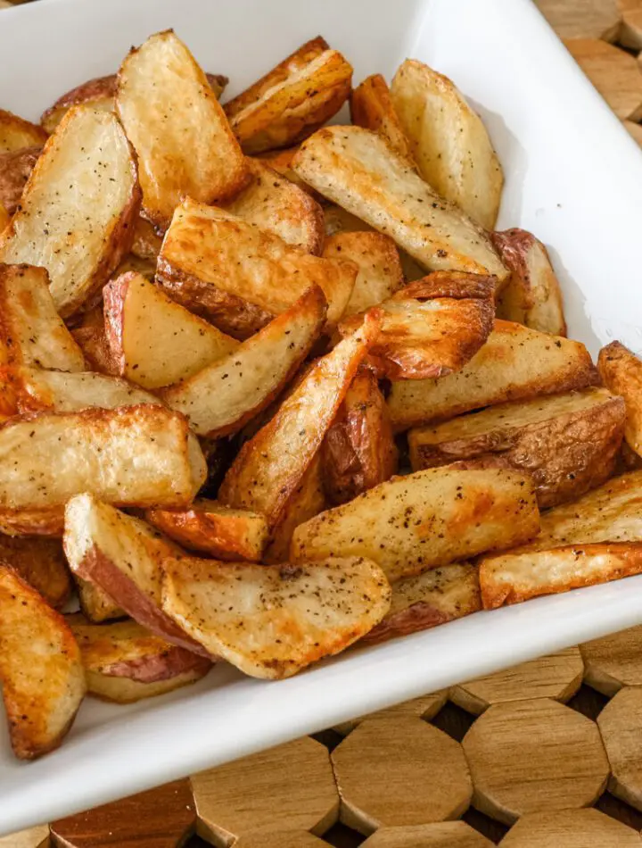 roasted potato wedges in a serving bowl