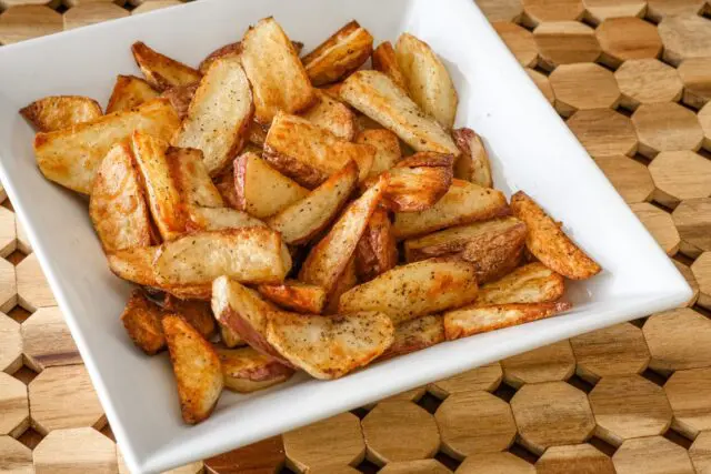 roasted potato wedges in a serving bowl