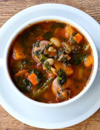 beans and sausage soup with carrots, ham, tomatoes.