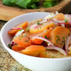 a colorful beet salad with red onions and a zesty lemon vinaigrette