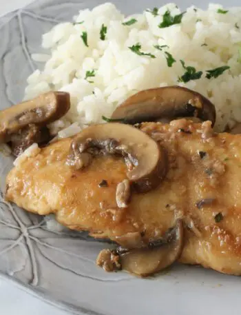 best chicken marsala with mushrooms on a plate with rice