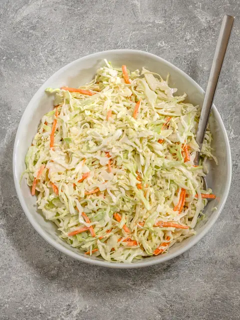 Creamy coleslaw in a serving bowl.