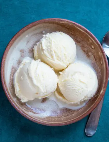 3 scoops of gelato in a bowl with a spoon