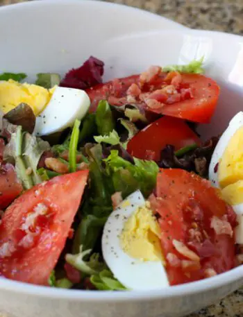 blt salad with hard boiled eggs in a serving bowl