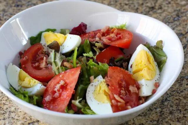 blt salad with hard boiled eggs in a serving bowl