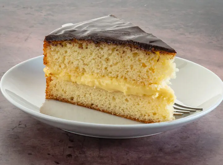 a slice of boston cream pie on a plate