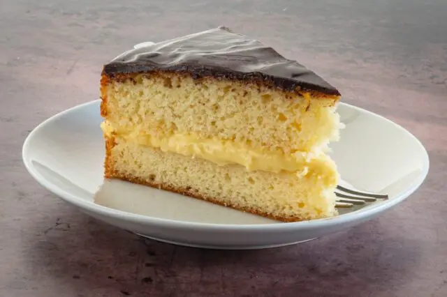 a slice of boston cream pie on a plate