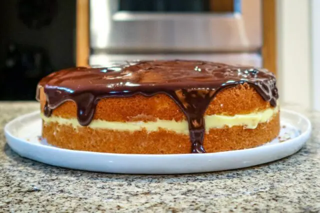 boston cream pie side view with ganache