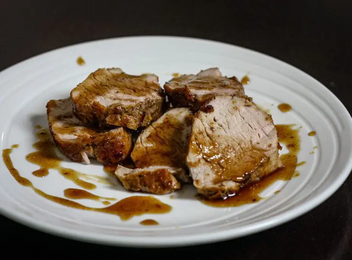 bourbon glazed pork tenderloin on a plate