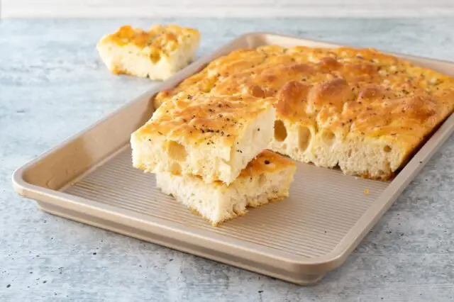 bread machine focaccia with slices in the pan