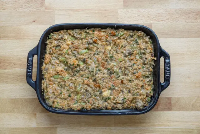 Sausage and brioche stuffing for Thanksgiving dinner, ready to pop into the oven and bake.