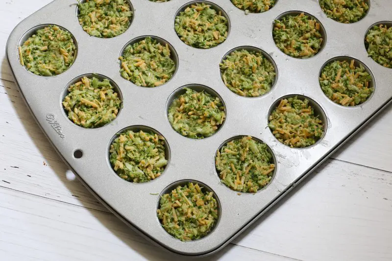 broccoli cheese bites preparation in a mini muffin tin