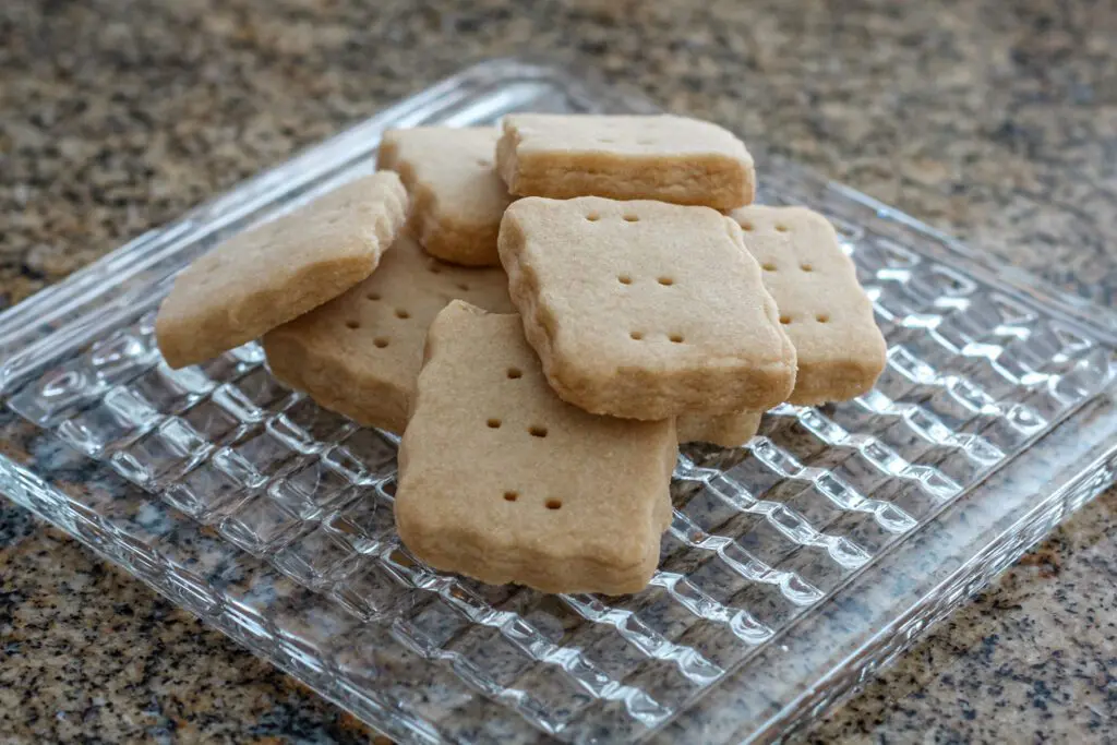several pieces of brown sugar shortbread on a glass trivet