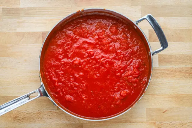 Hand crushed San Marzano tomatoes are simmered while the pasta cooks.