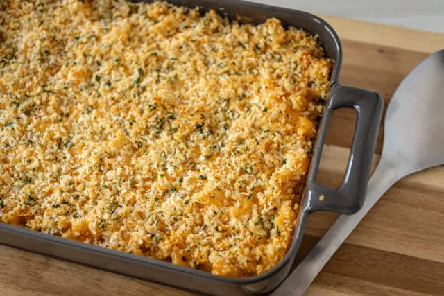 A baking dish with buffalo chicken macaroni and cheese.