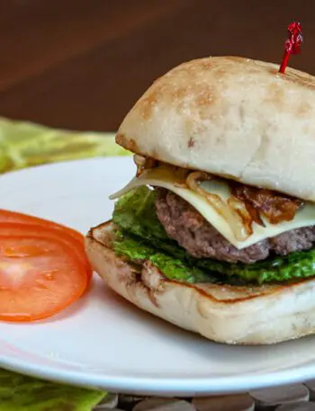 burger with caramelized onions on a ciabatta bun