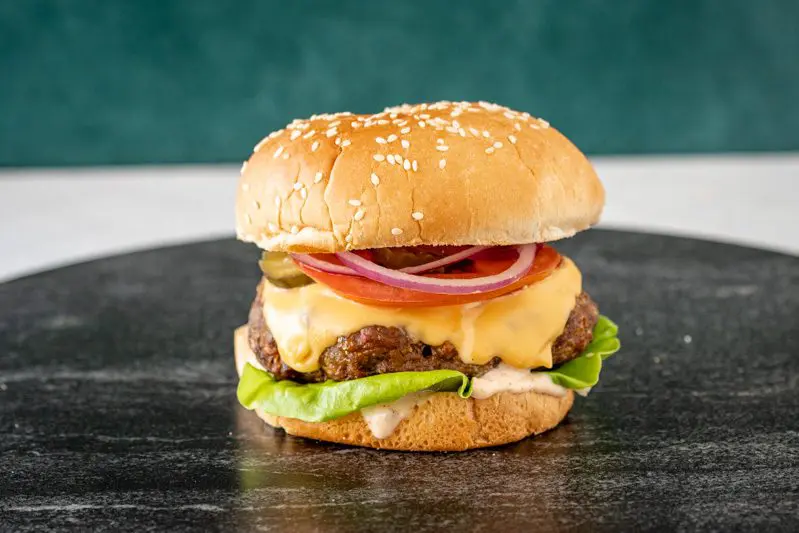 perfectly grilled burger with chipotle mayonnaise sauce