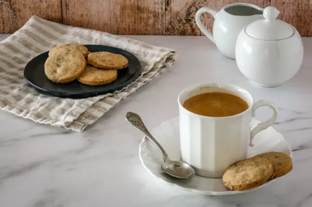 butter pecan shortbread on plates with coffee