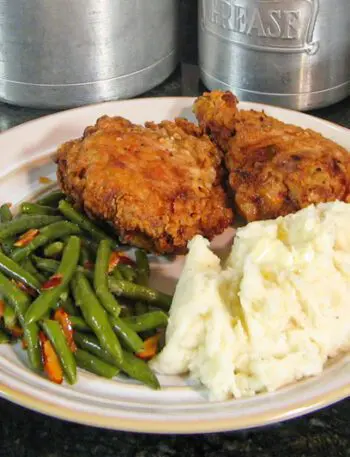 Plate with buttermilk fried chicken, mashed potatoes, and green beans