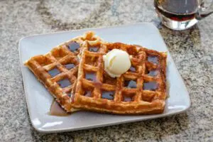 buttermilk waffles with syrup and butter